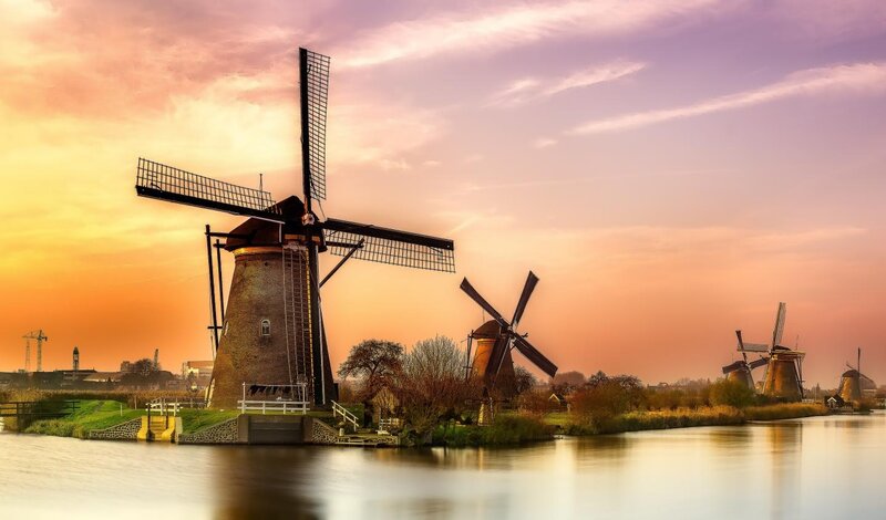 Windmills at Sunset — Orange, Serene, Photograph, River, Sky