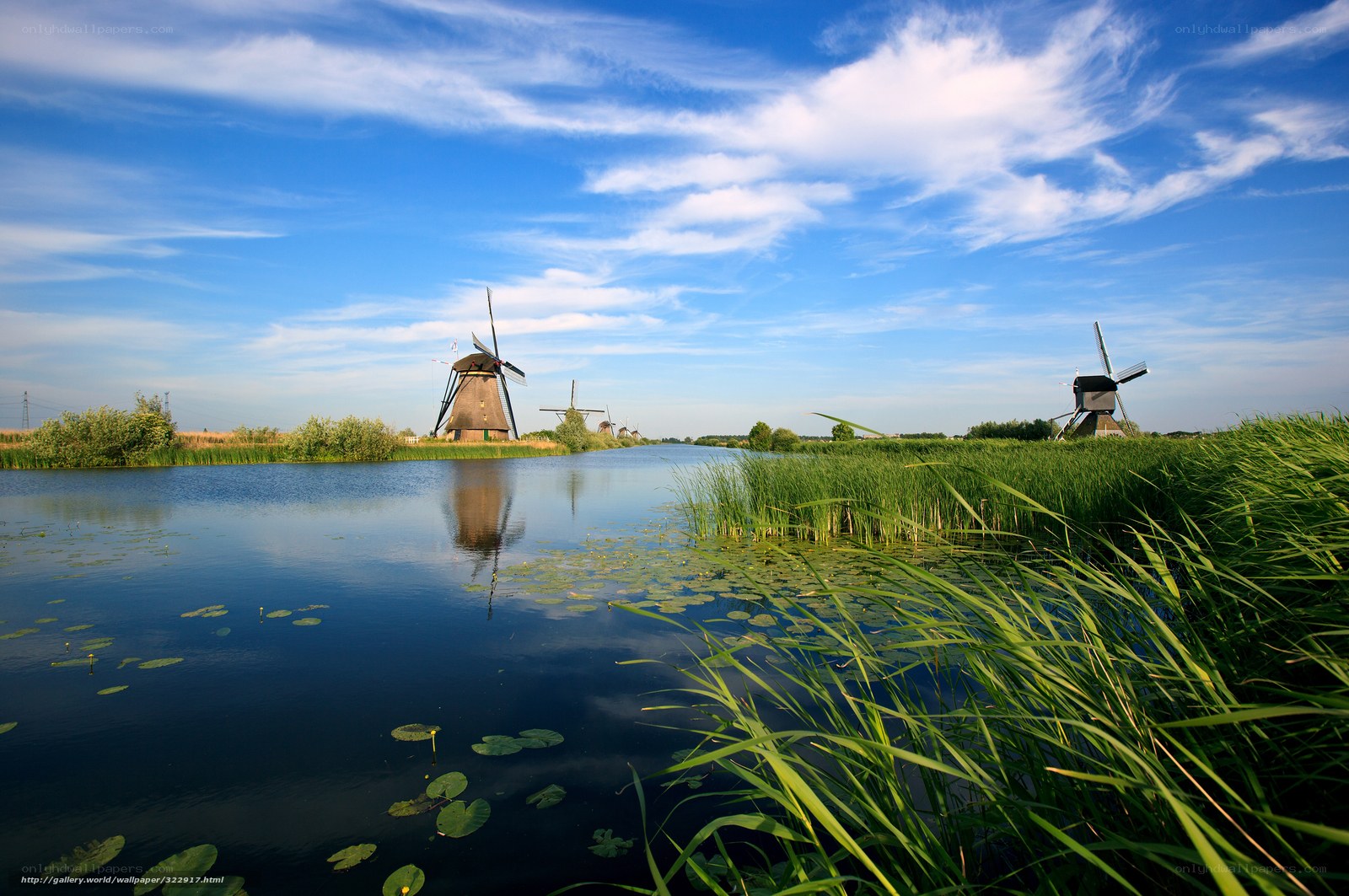 Windmills by a canal