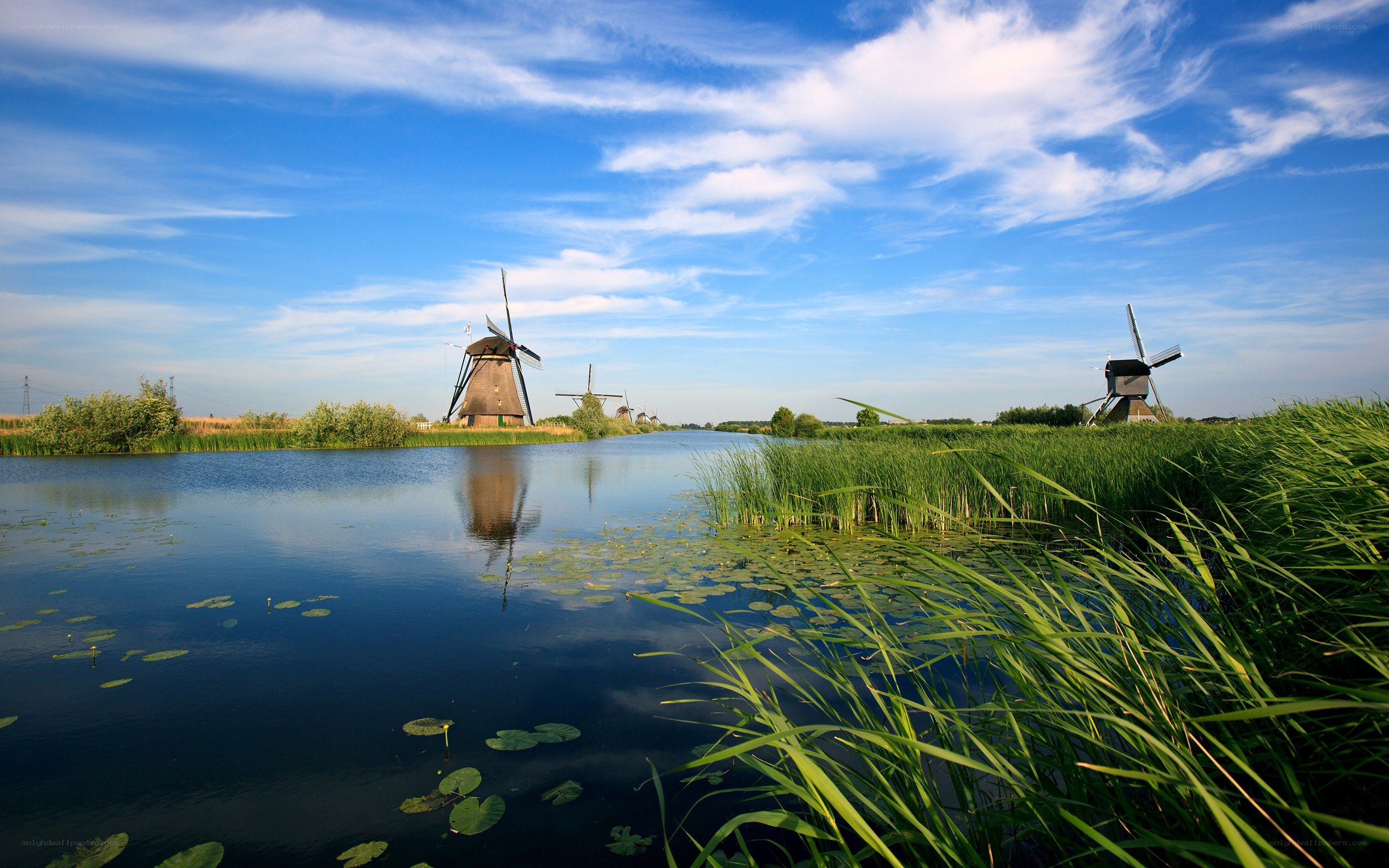 Windmills by a canal