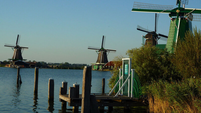Windmills by a Canal — Green, Serene, Afternoon