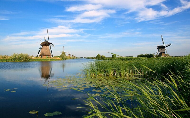 Windmills by a canal in the Netherlands