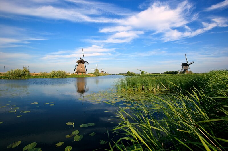 Windmills by a canal
