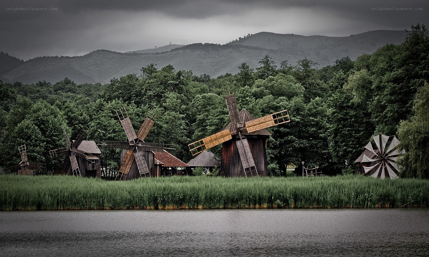 Windmills by a lake