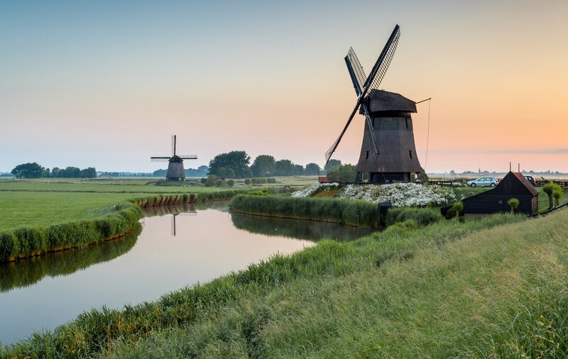 Windmills in a Field — Green, Serene, Sunset