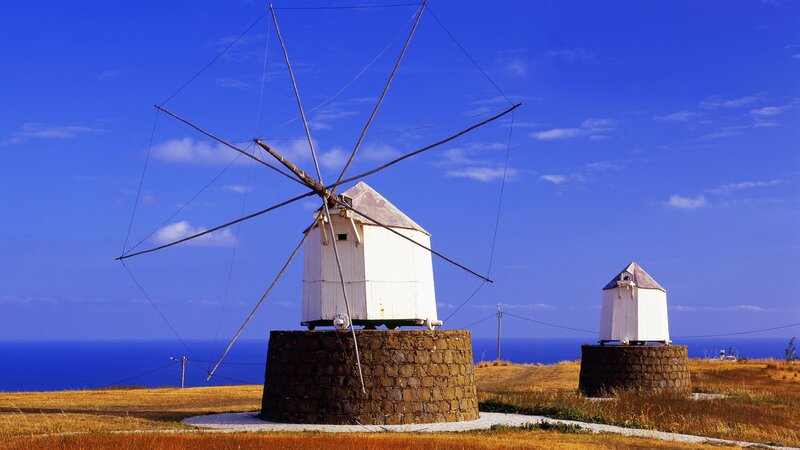 Windmills on a coastal hill
