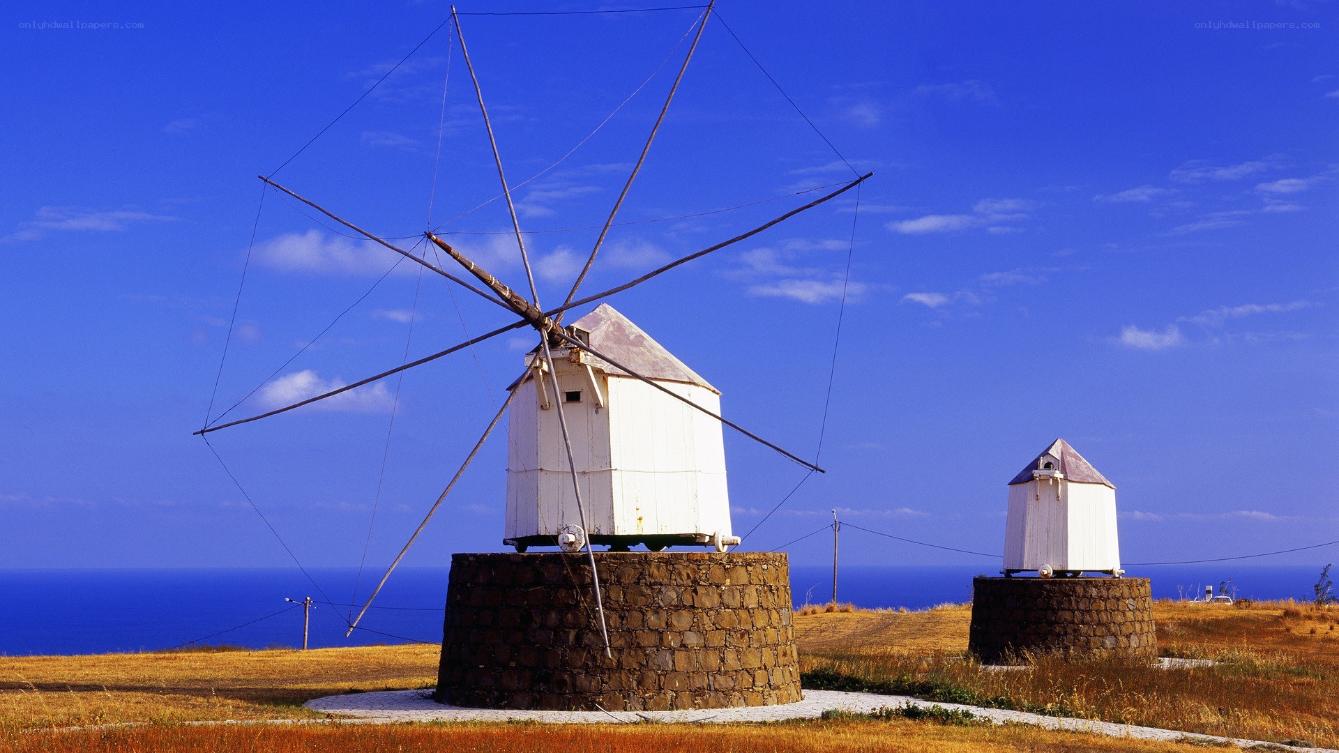 Windmills on a coastal hill