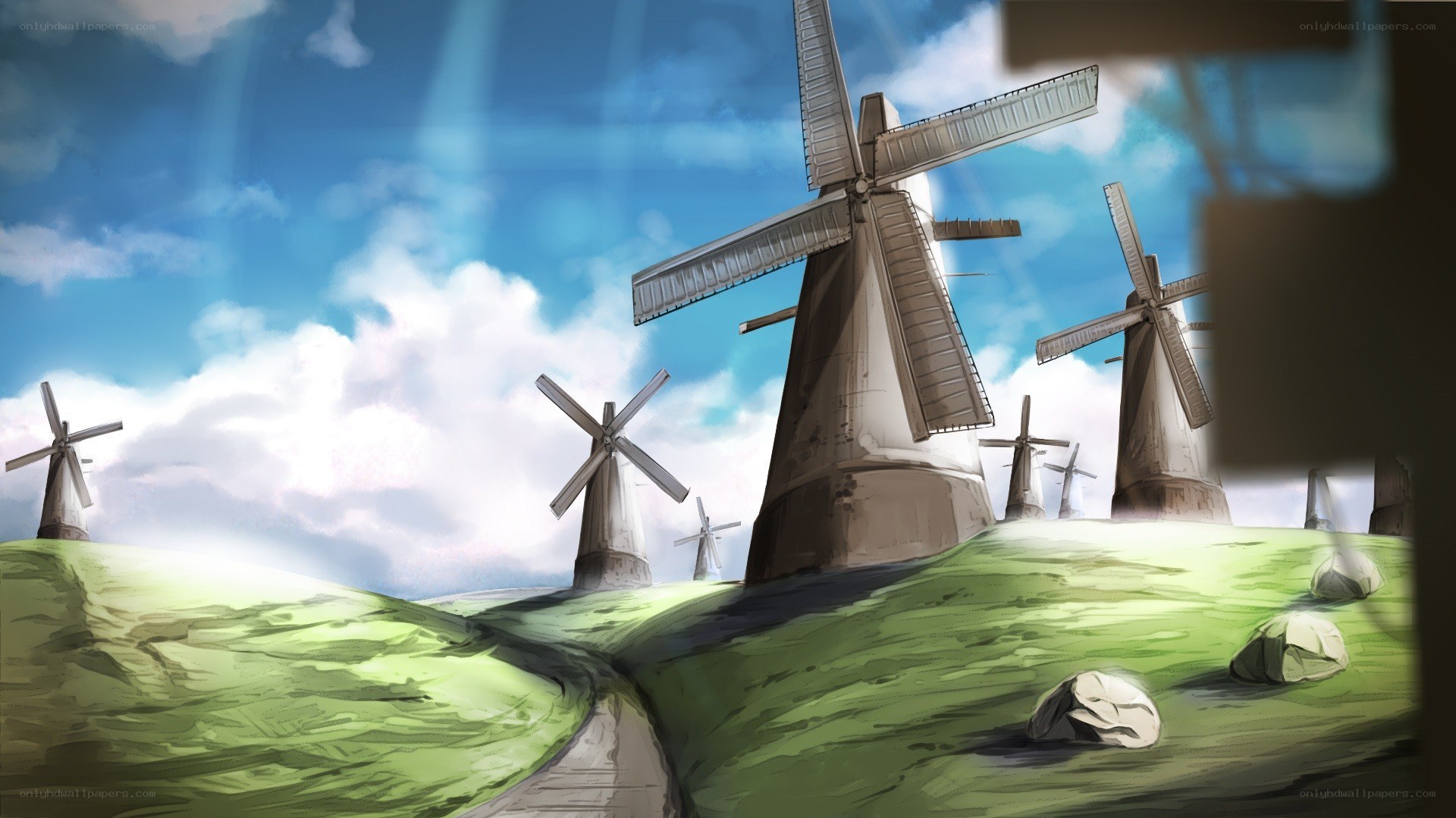 windmills on a green hill
