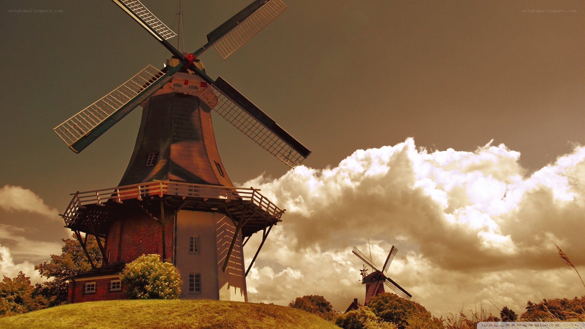 Windmills under cloudy sky