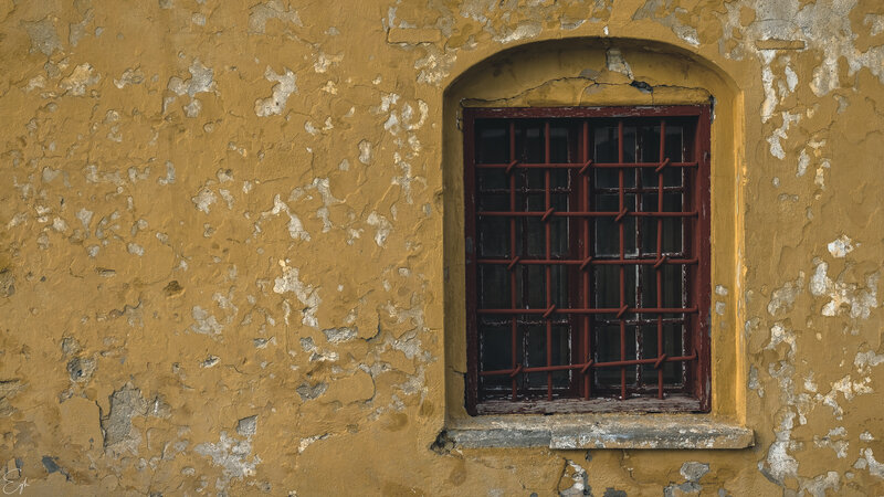 Window with Bars on Wall
