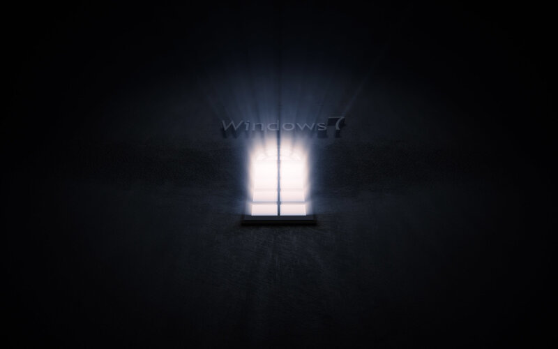 Windows 7 logo in dark room