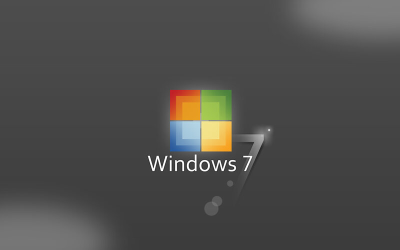 Windows 7 logo on dark background
