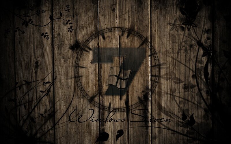 Windows 7 on wooden background