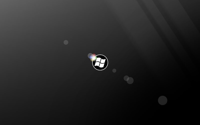 Windows Logo on Dark Background — Black, Dark, Sleek, Minimalist, Light Flare