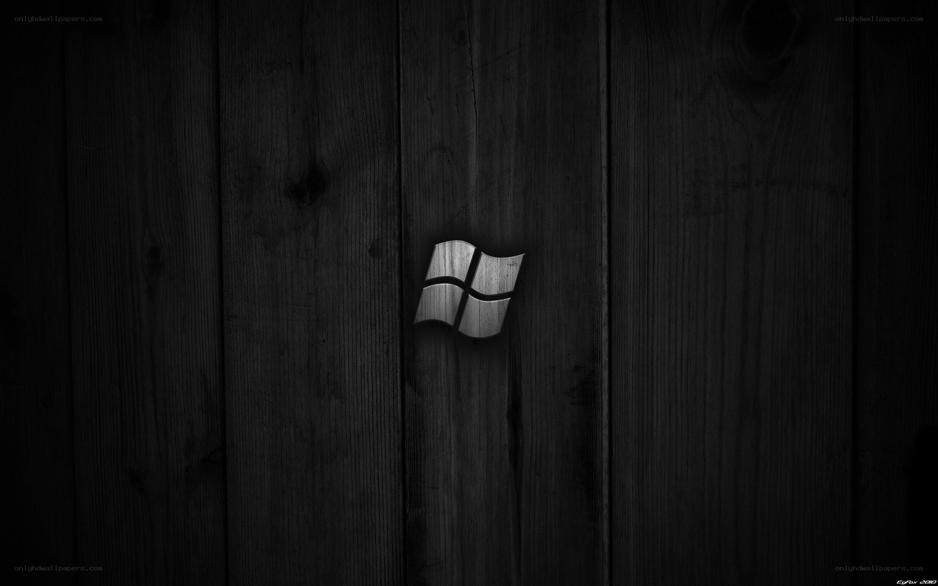 Windows logo on dark wood