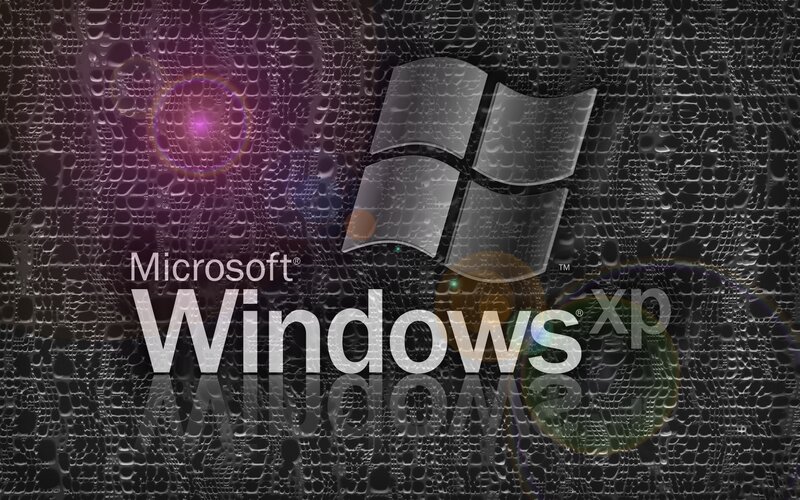 Windows XP logo on textured background