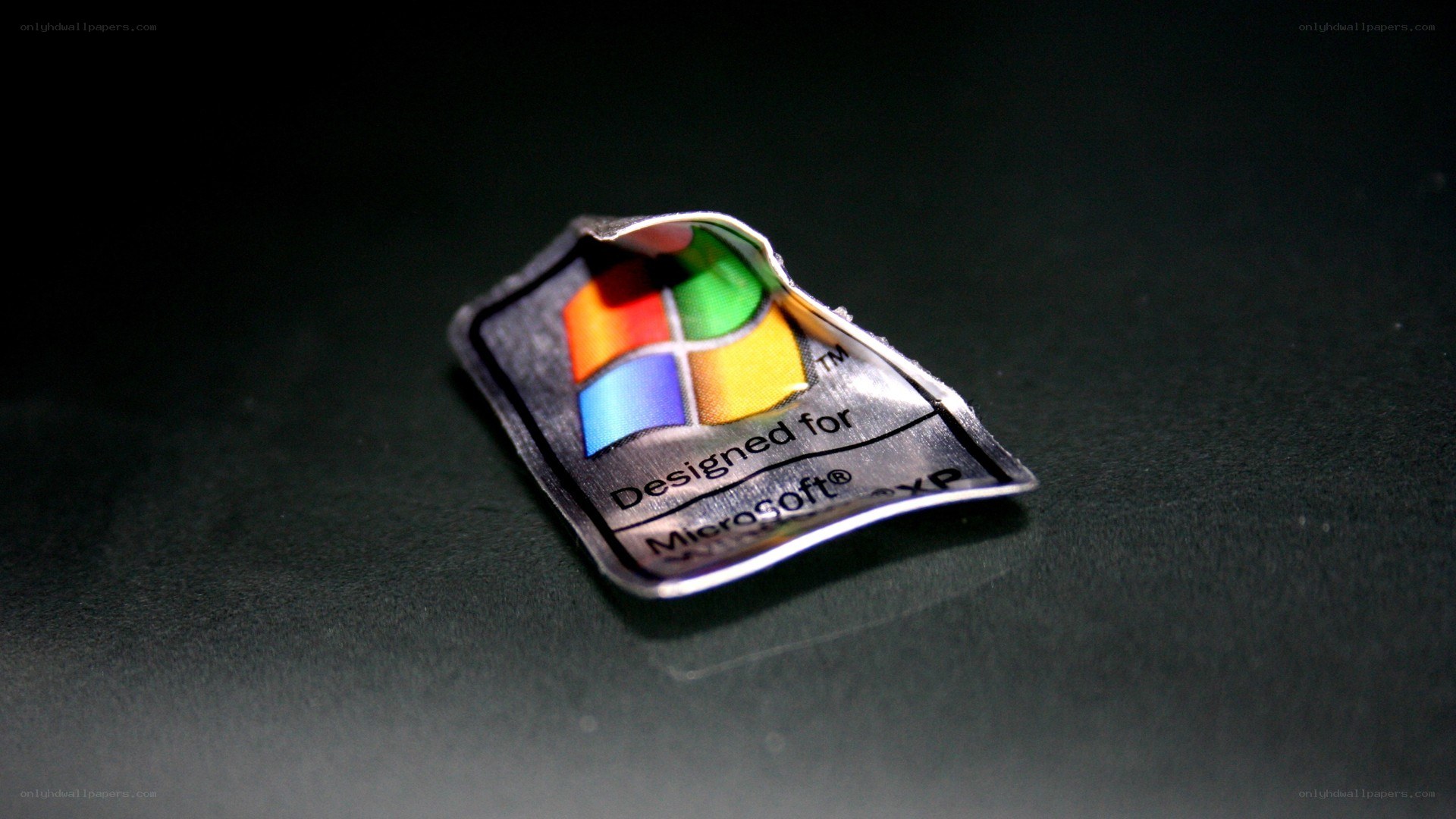 Windows XP sticker on dark surface