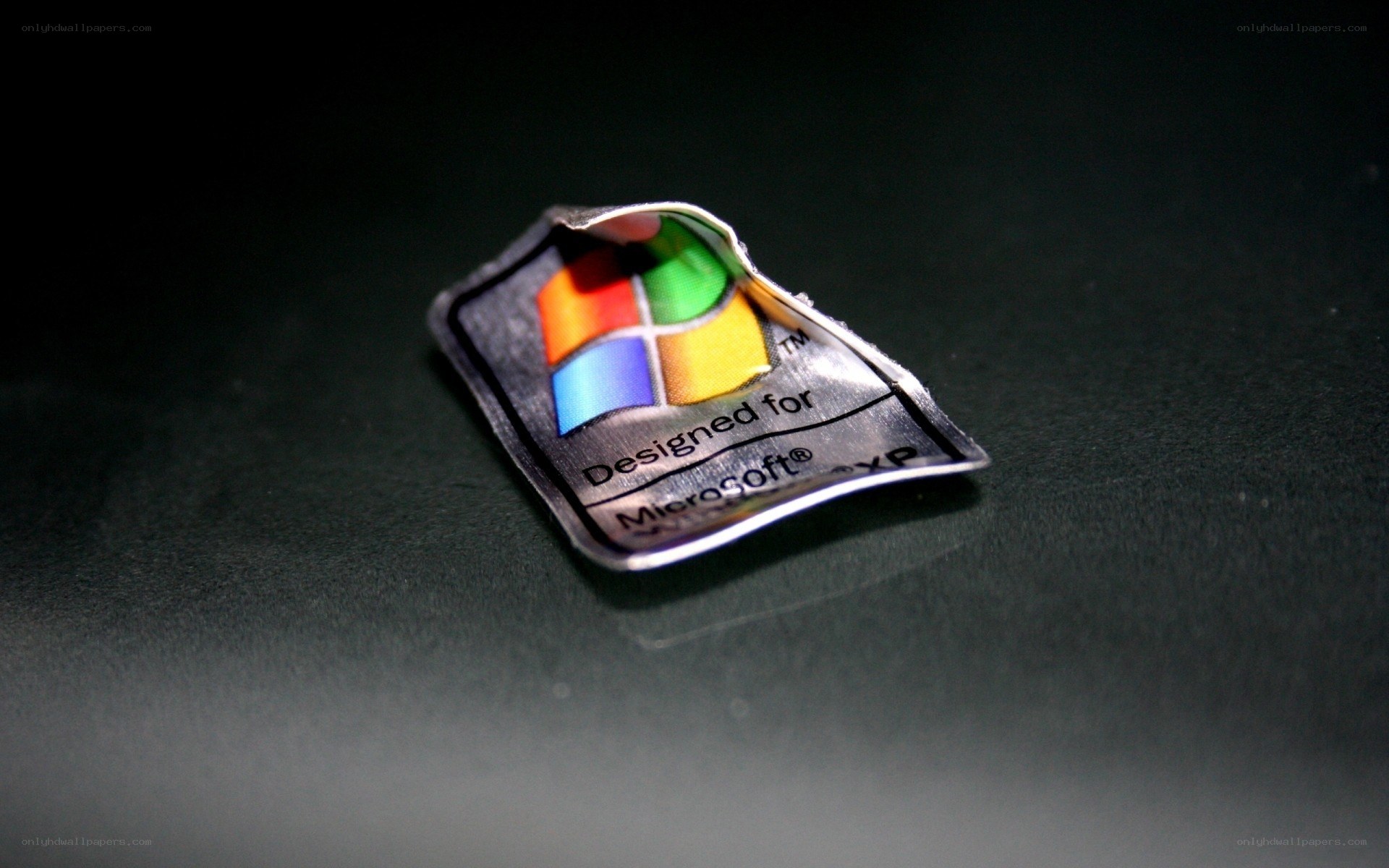 Windows XP sticker on dark surface