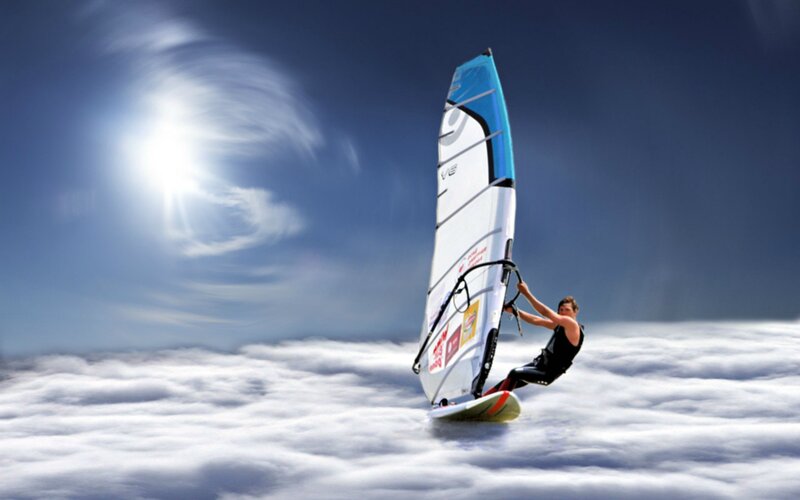 Windsurfer Above Clouds