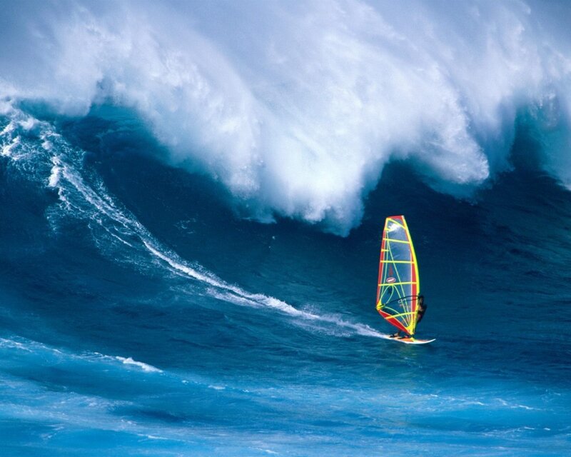 Windsurfer on a massive wave