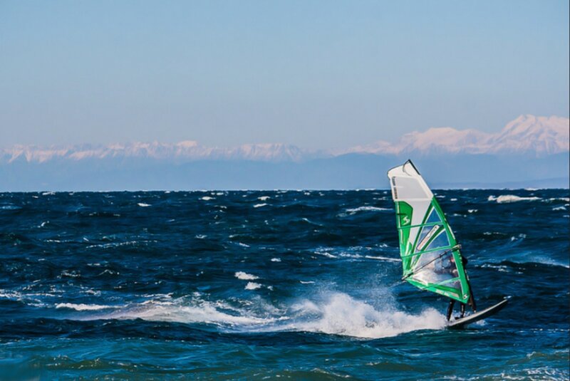 Windsurfer on Ocean — Blue