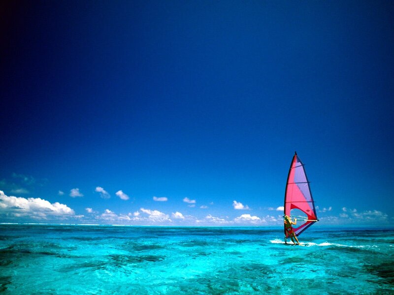 Windsurfer on turquoise water