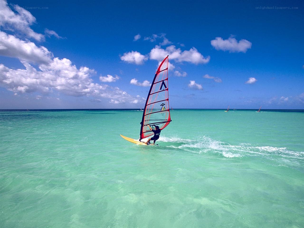 Windsurfer on turquoise water