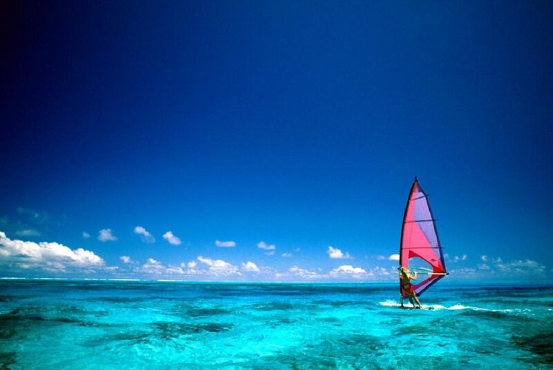 Windsurfer on Turquoise Water — Blue