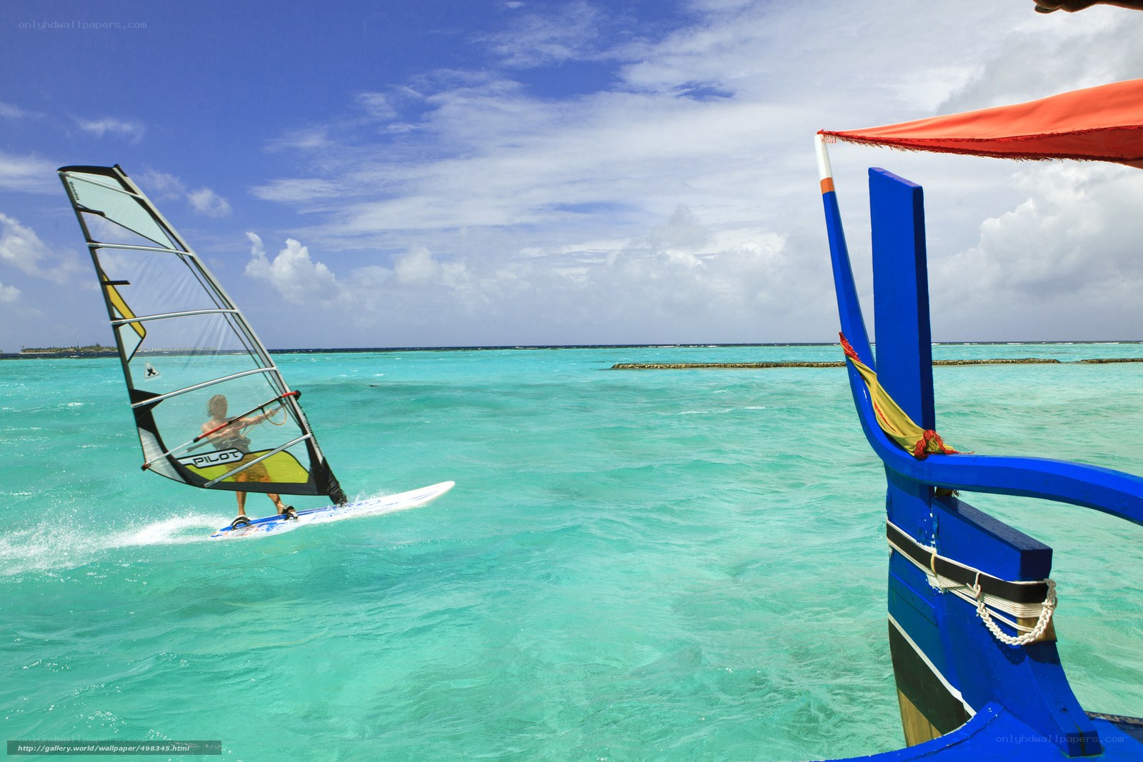 Windsurfer on turquoise water