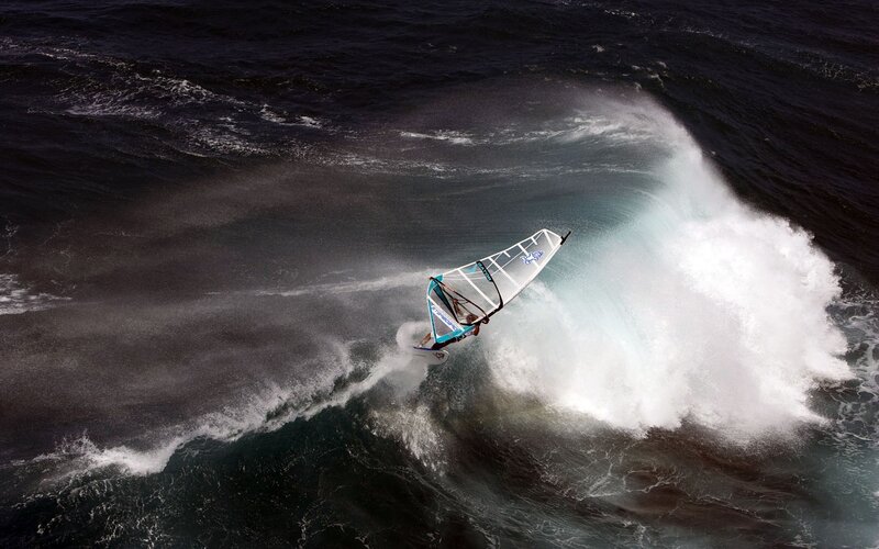 Windsurfer riding a wave