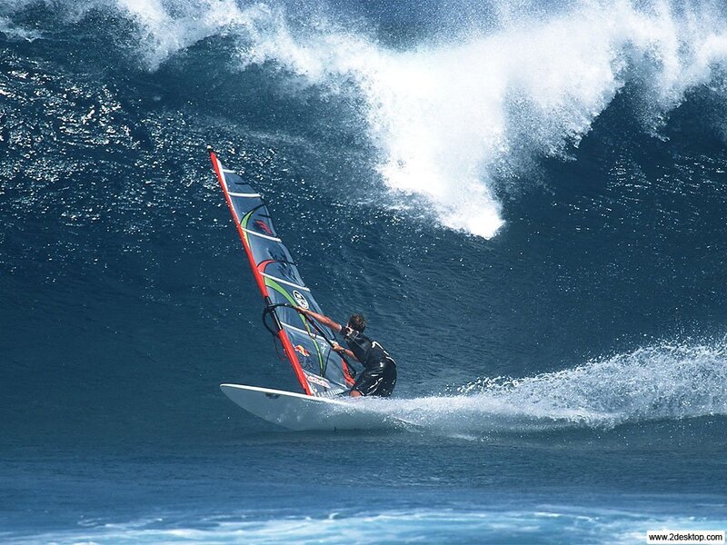 windsurfer riding a wave