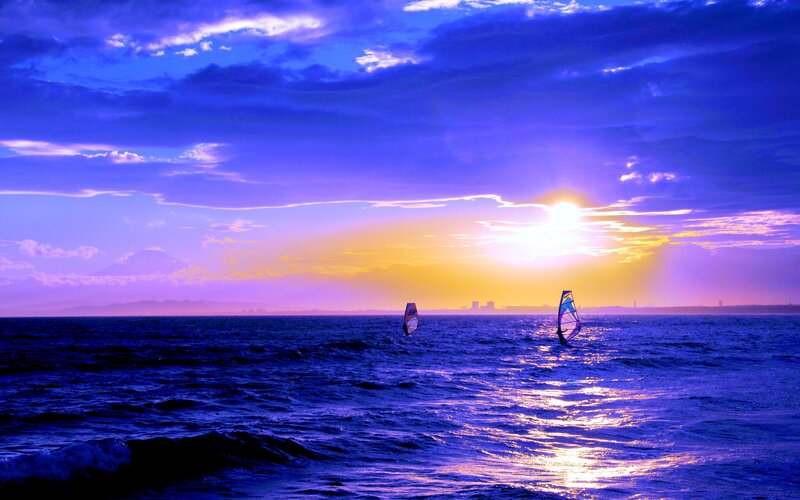 Windsurfers on Ocean — Blue