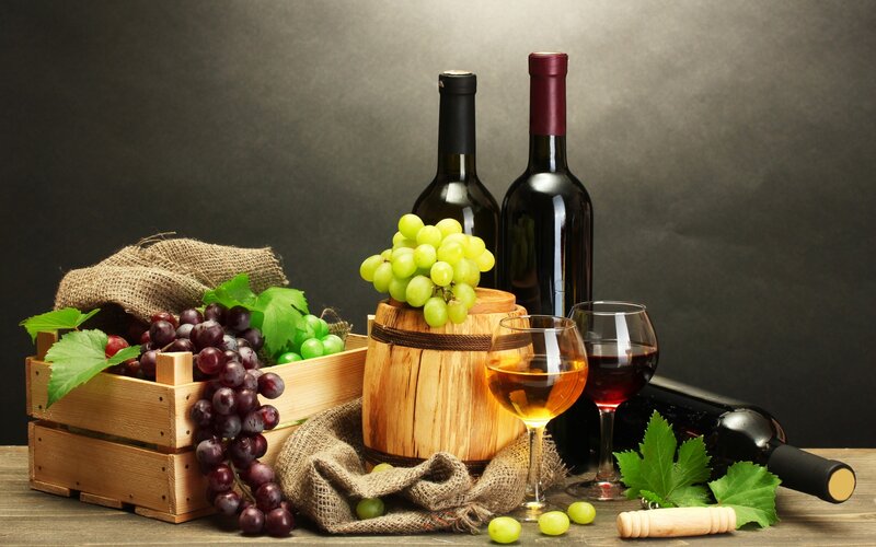 Wine and Grapes on Table — Brown, Dramatic, Photograph, Wine Bottles