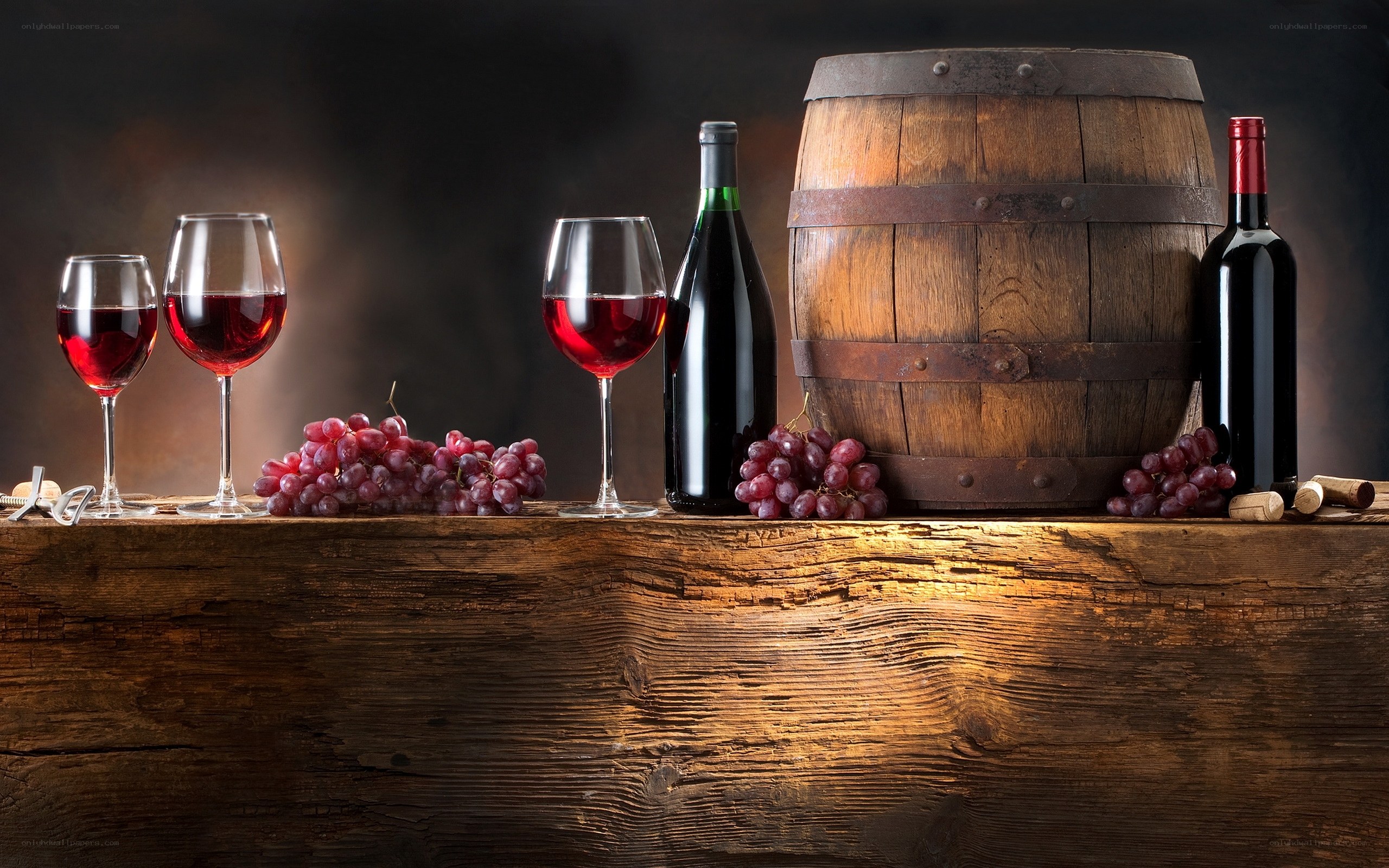Wine and grapes on wooden table