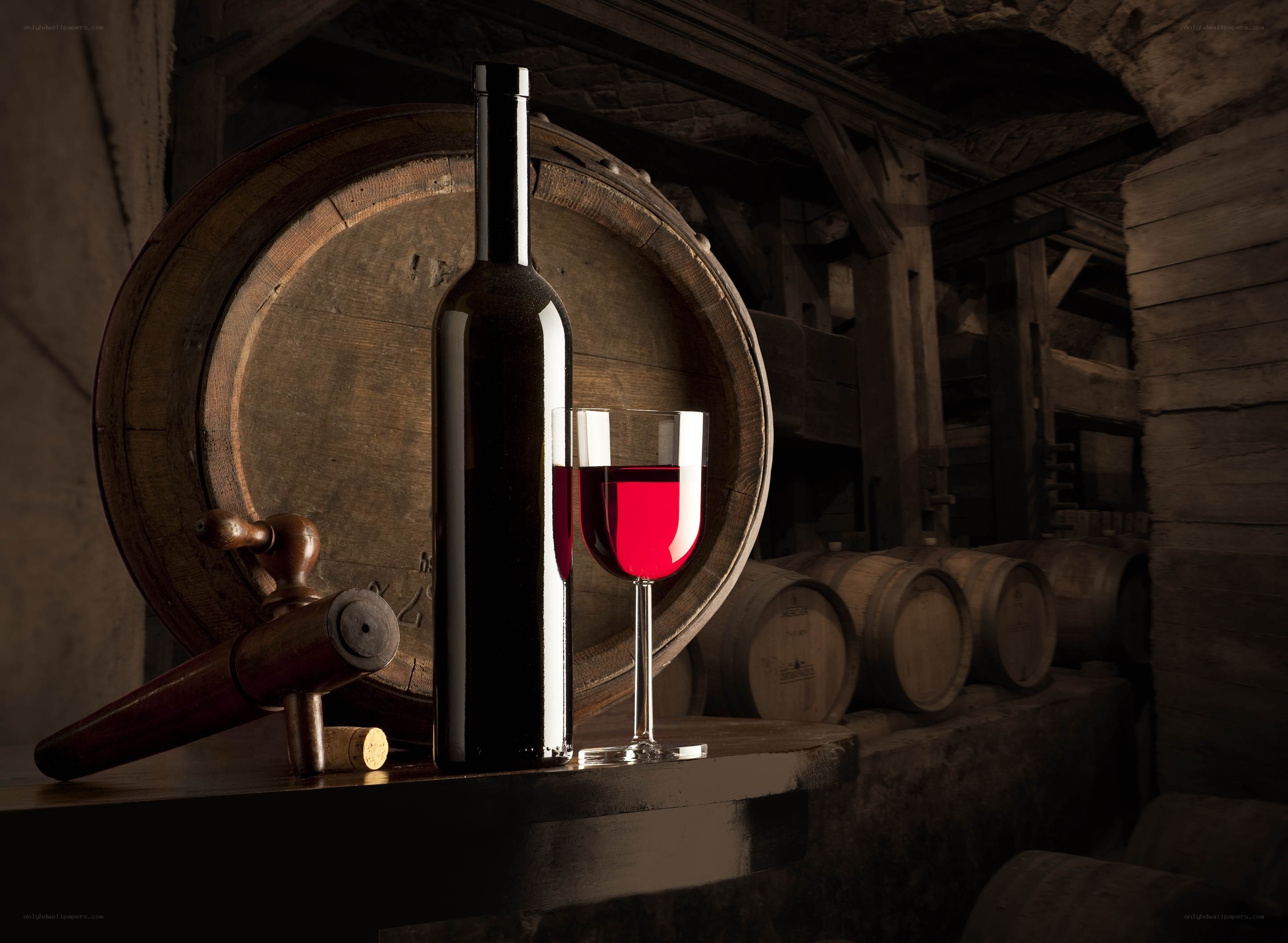 Wine bottle and glass in cellar