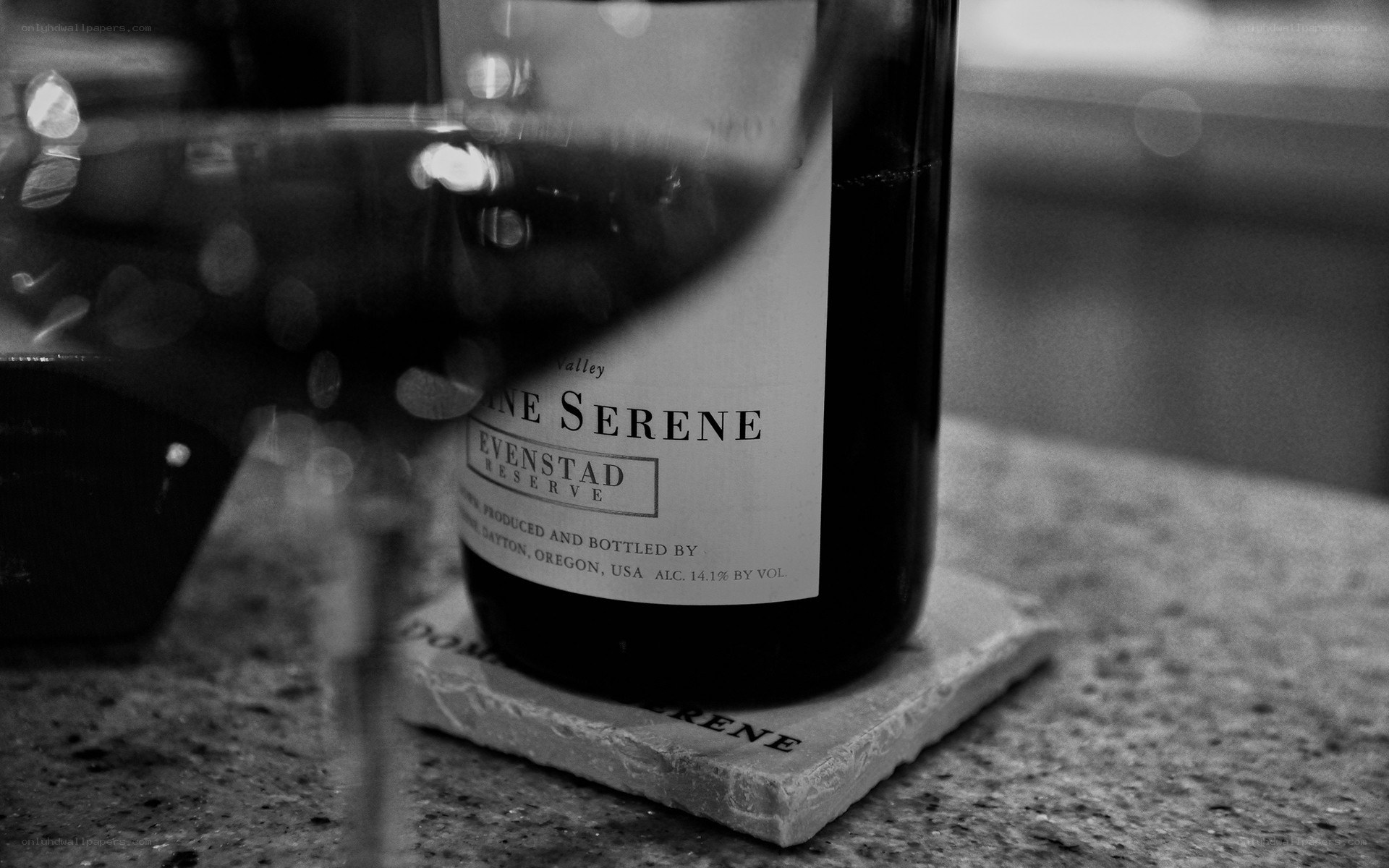 wine bottle and glass on stone
