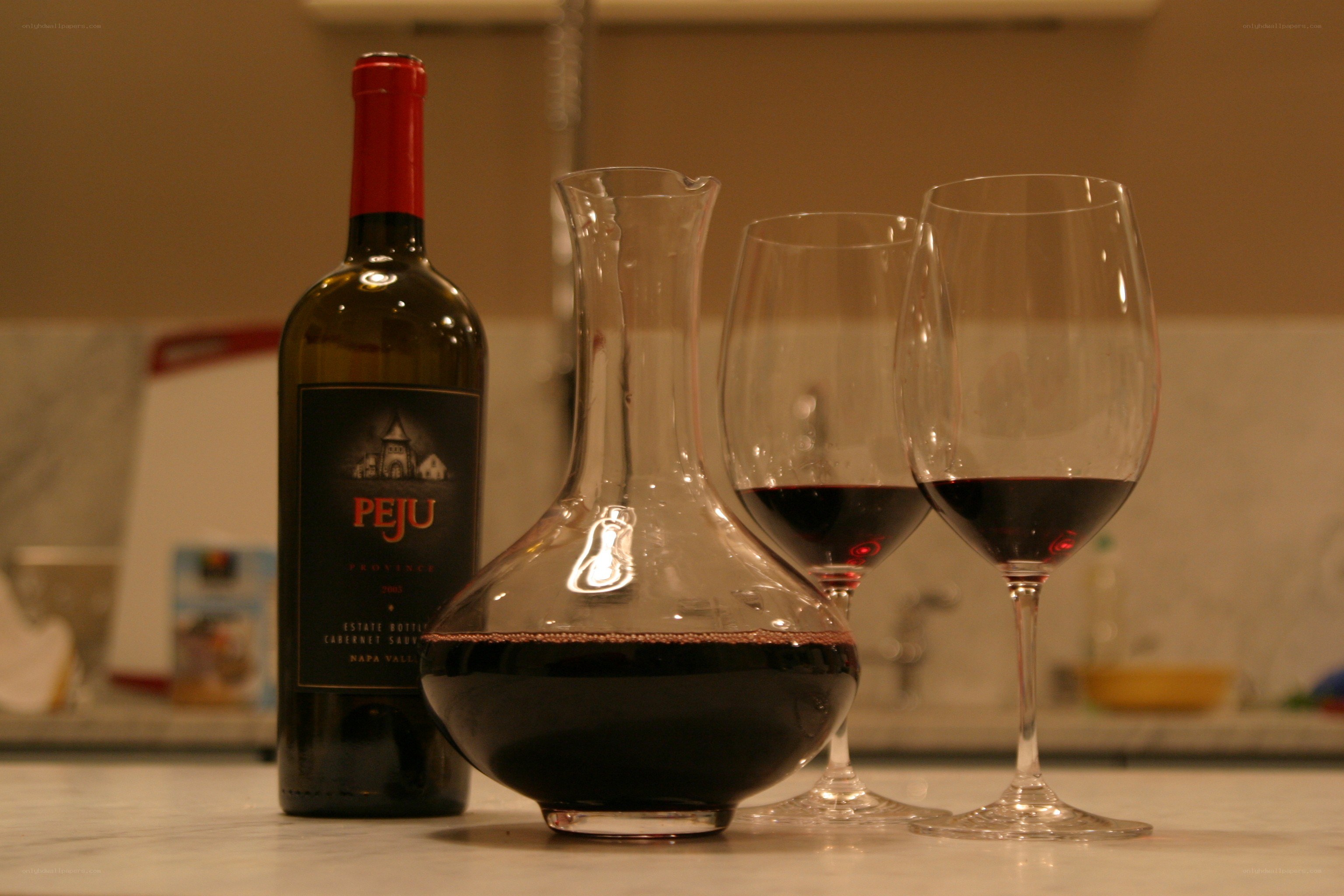 Wine bottle and glasses on counter