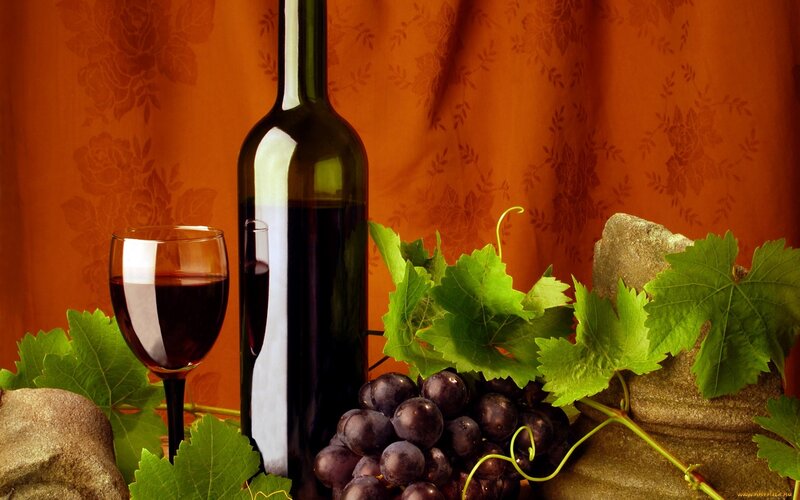 wine bottle with grapes and leaves