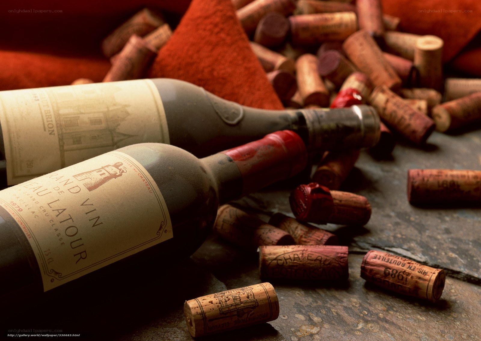 Wine bottles and corks on stone