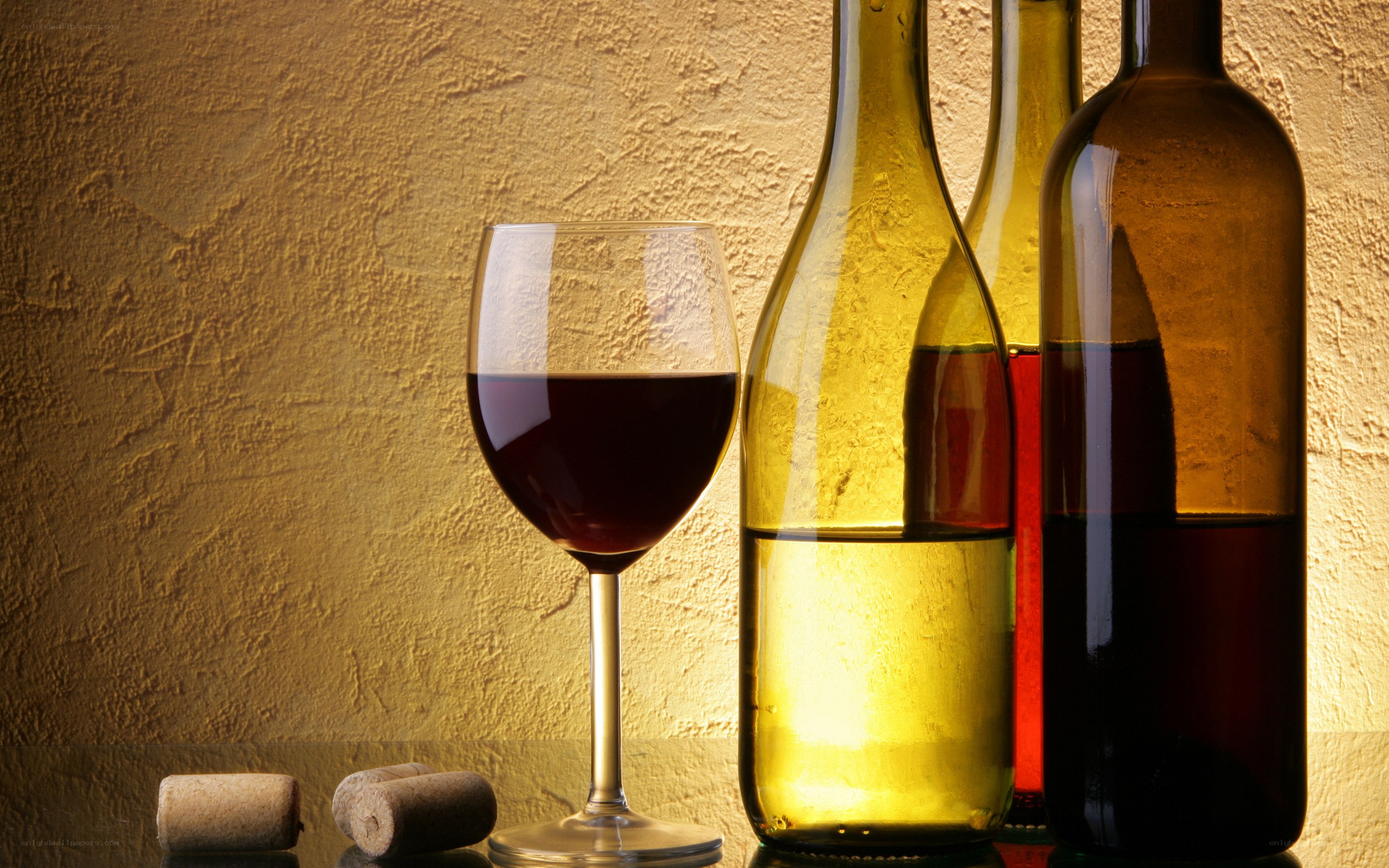 wine bottles and glass on table