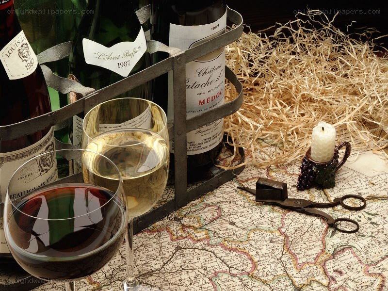 wine bottles and glasses on map