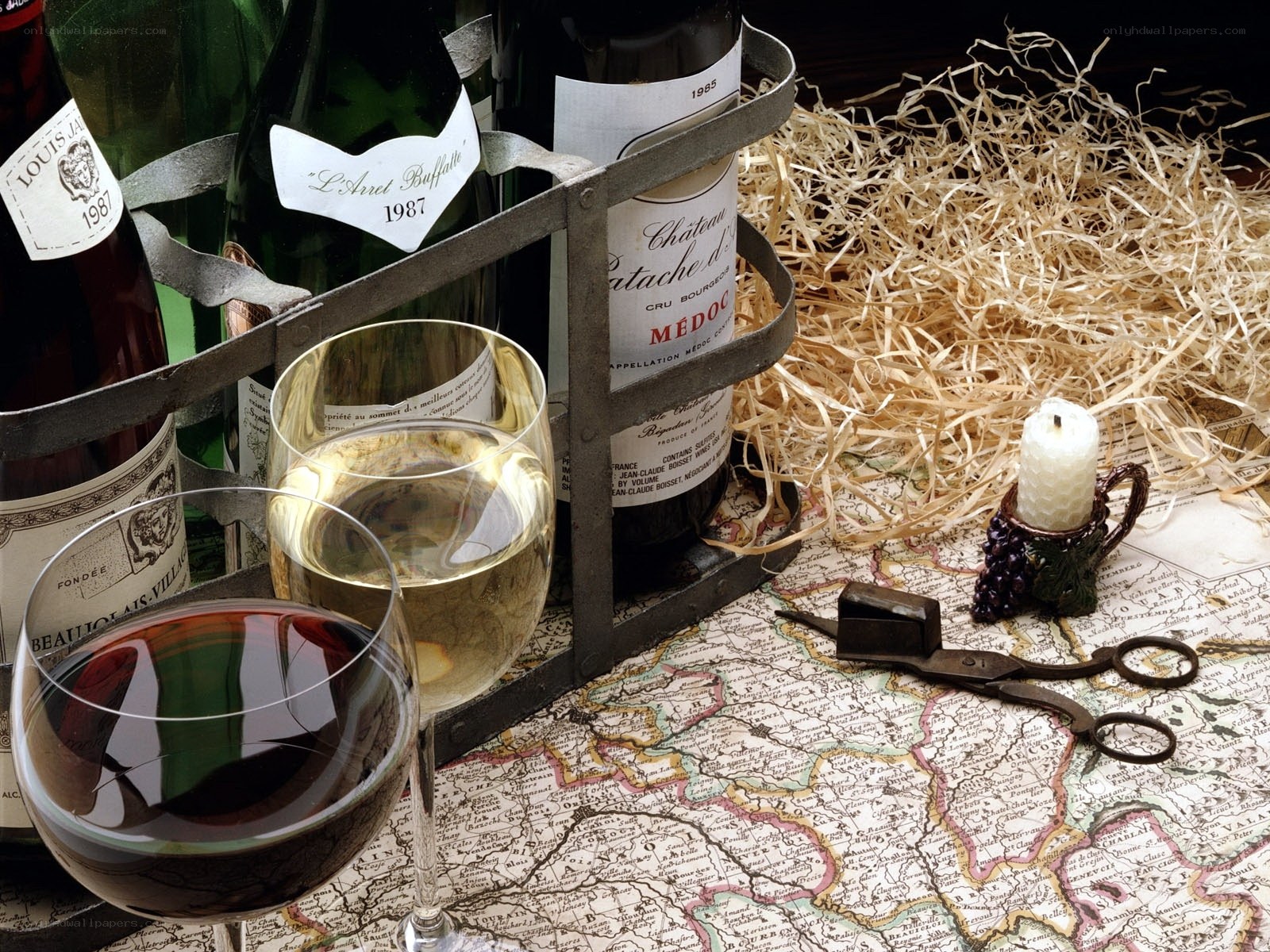 Wine bottles and glasses on map