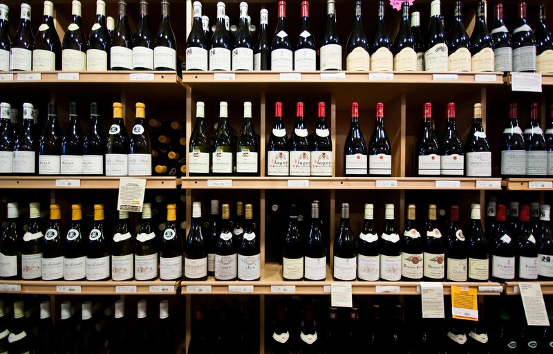 Wine bottles on store shelves