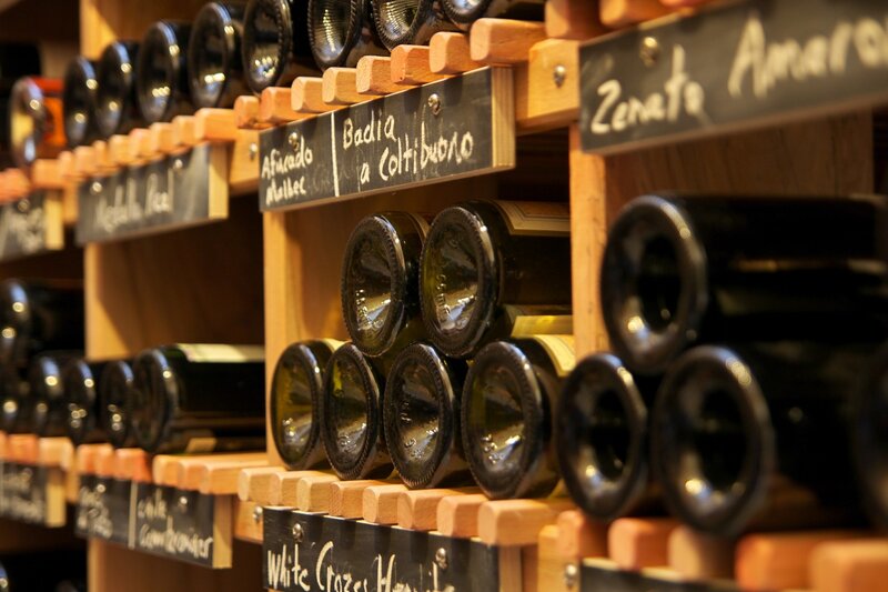Wine bottles on wooden shelves