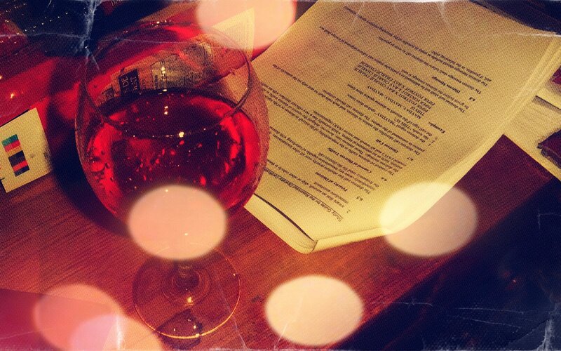 wine glass and book on table