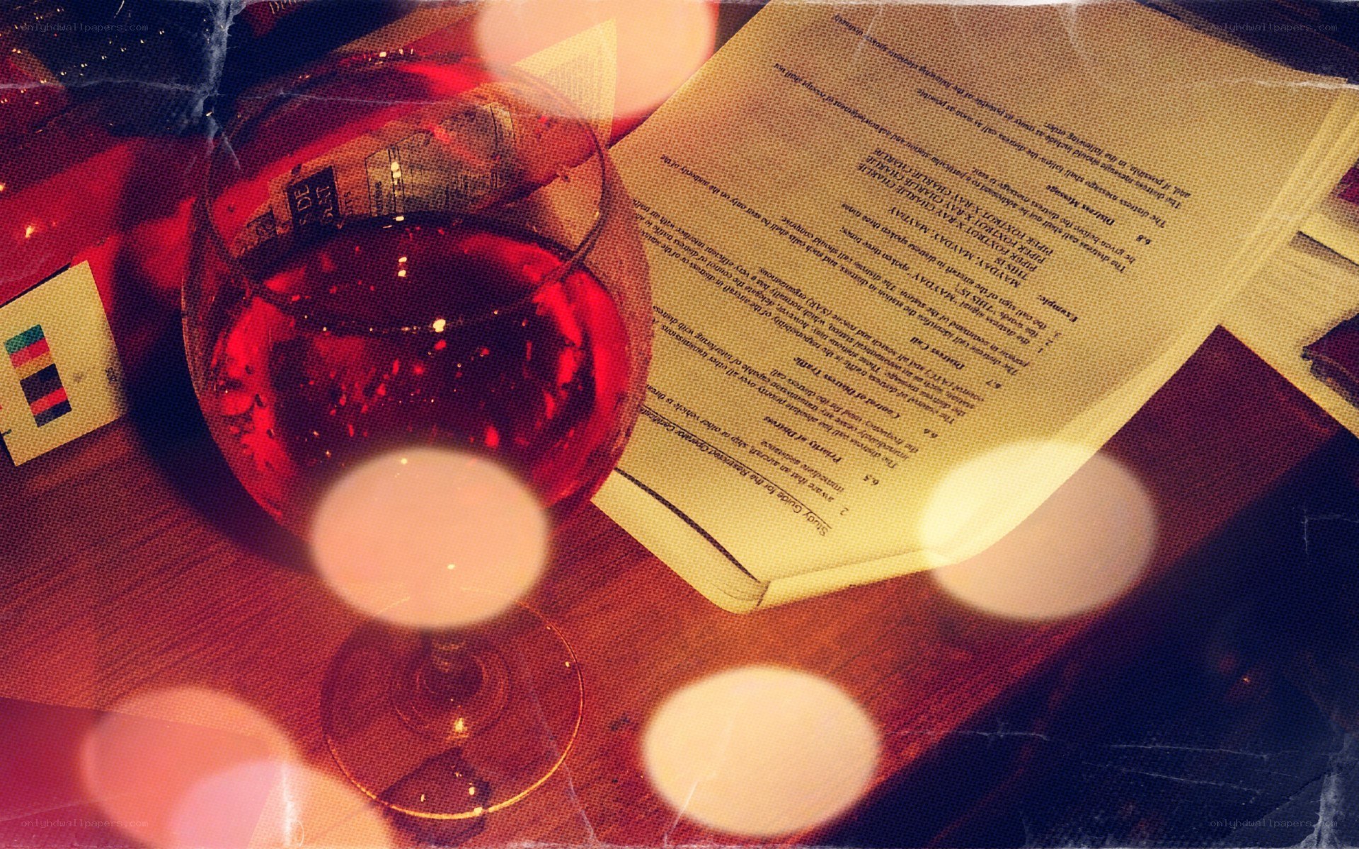 wine glass and book on table