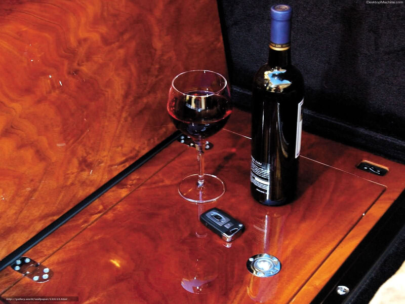 wine glass and bottle on wood