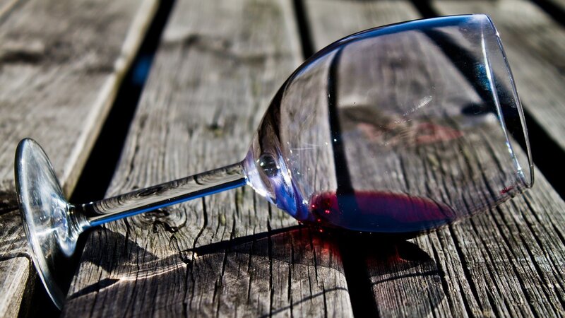 wine glass on wooden surface