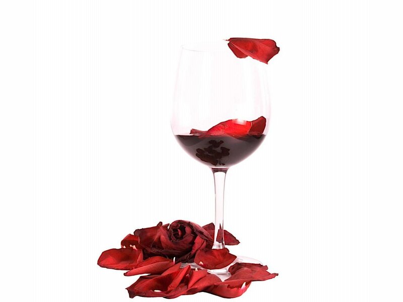wine glass with rose petals