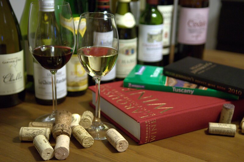 Wine glasses and books on a table
