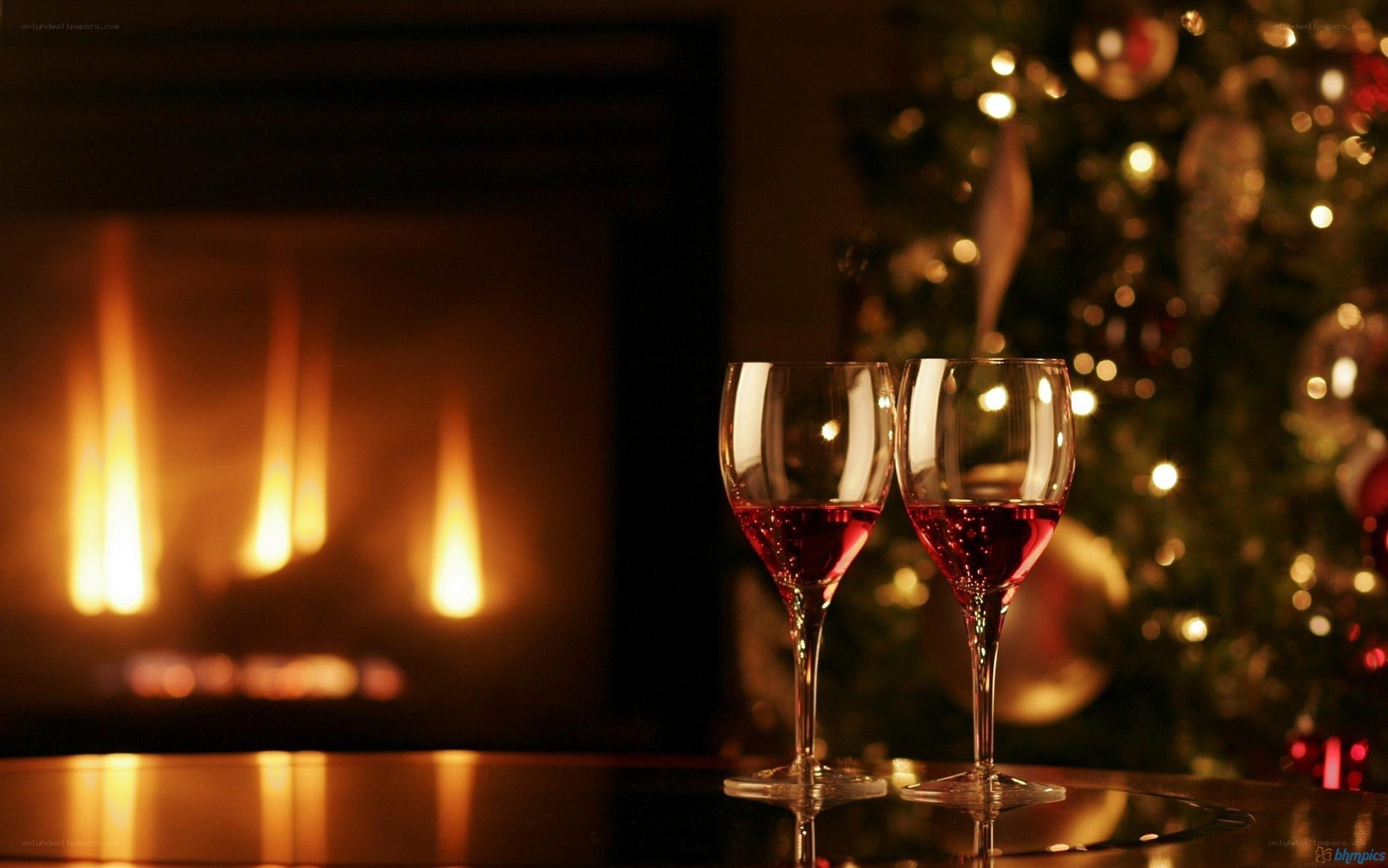 Wine glasses by fireplace